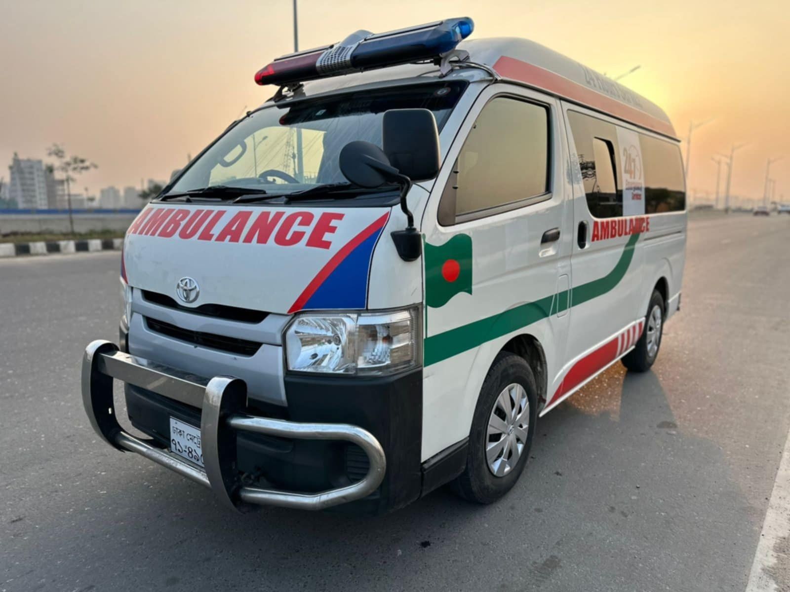Ambulance BD 24 AC ambulance on a road in Dhaka